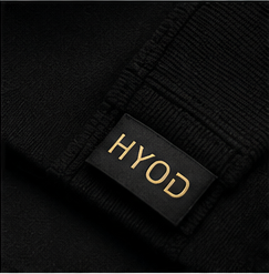 Black knitwear with a HYOD label