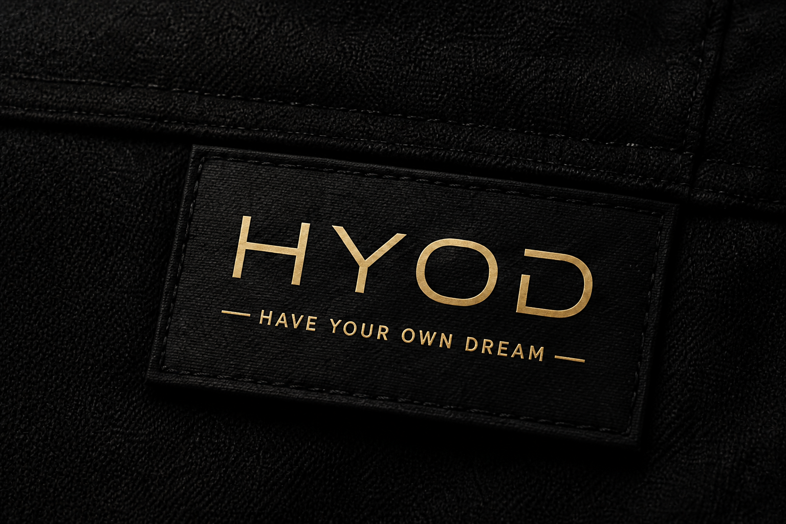 HYOD label sewn onto black clothing