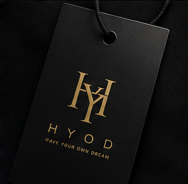 Gold HYOD monogram on a black hang tag