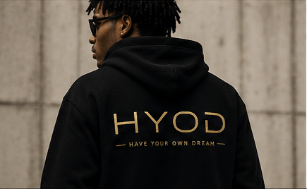 Person wearing a black HYOD hoodie